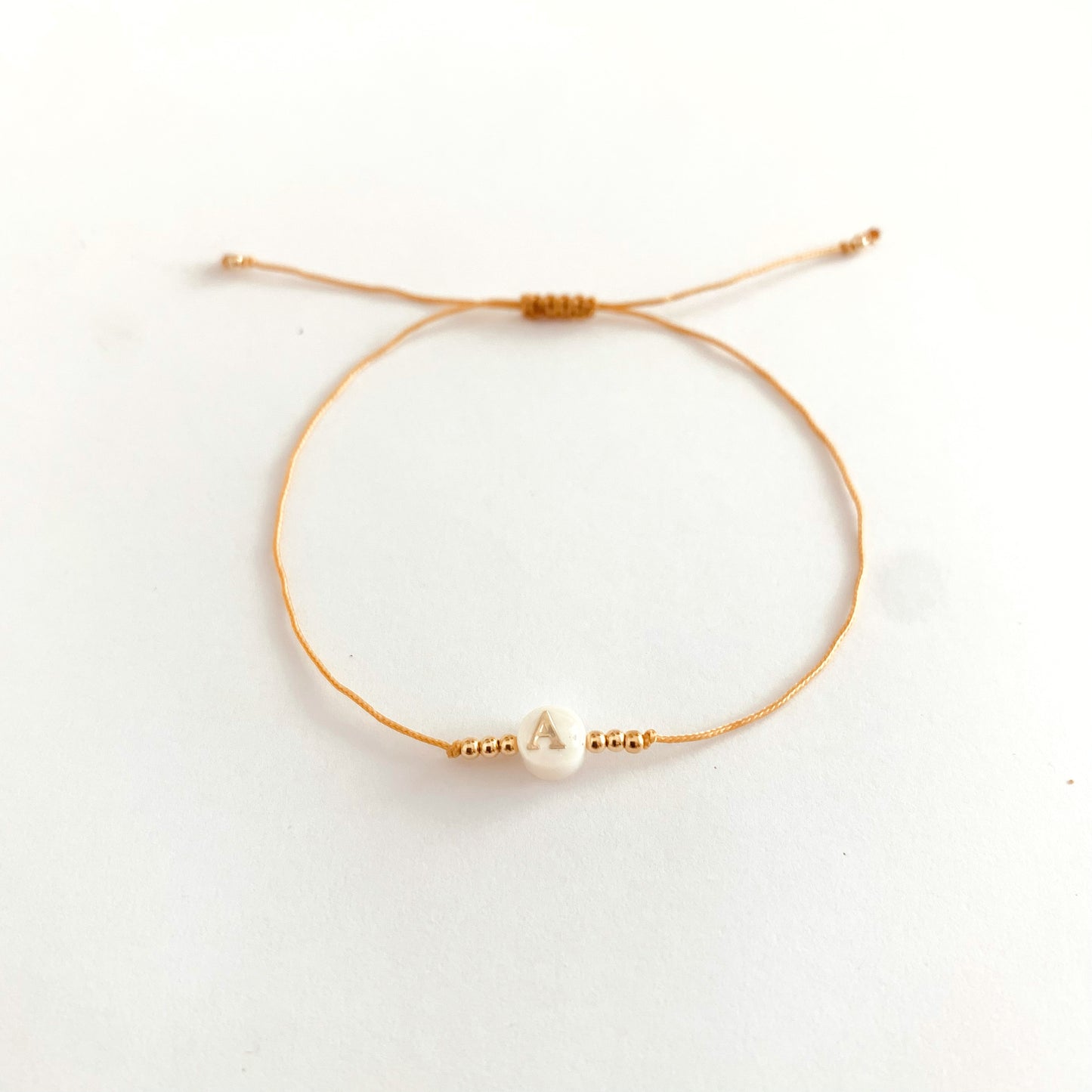 Perle alphabet en nacre